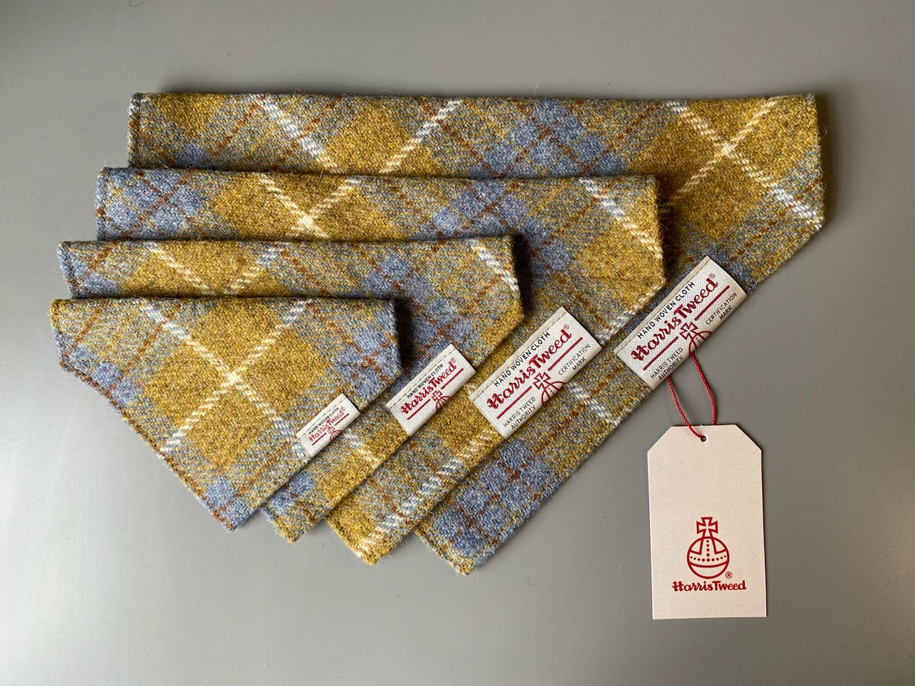 Harris Tweed dog bandana neckerchief in Mustard yellow / gold & blue check tartan or plaid pattern. Sizes S, M, L + XL pet scarf