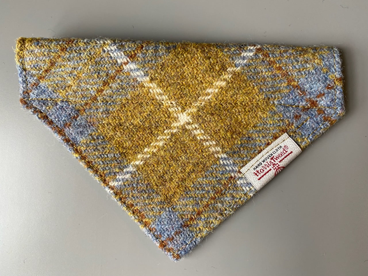 Harris Tweed dog bandana neckerchief in Mustard yellow / gold & blue check tartan or plaid pattern. Sizes S, M, L + XL pet scarf