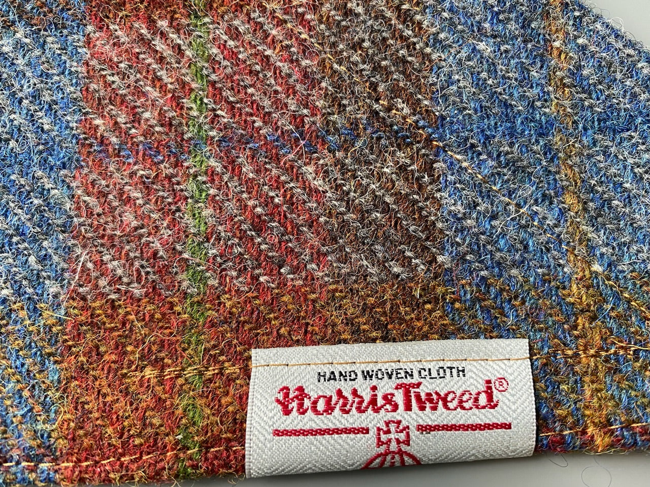 Harris Tweed dog bandana neckerchief in rust orange, blue & brown check tartan or plaid pattern. Sizes S, M, L + XL pet scarf