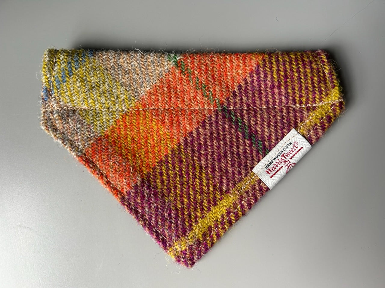 Harris Tweed dog bandana neckerchief in orange beige and purple in a check, tartan pattern. Sizes S M L XL pet scarf