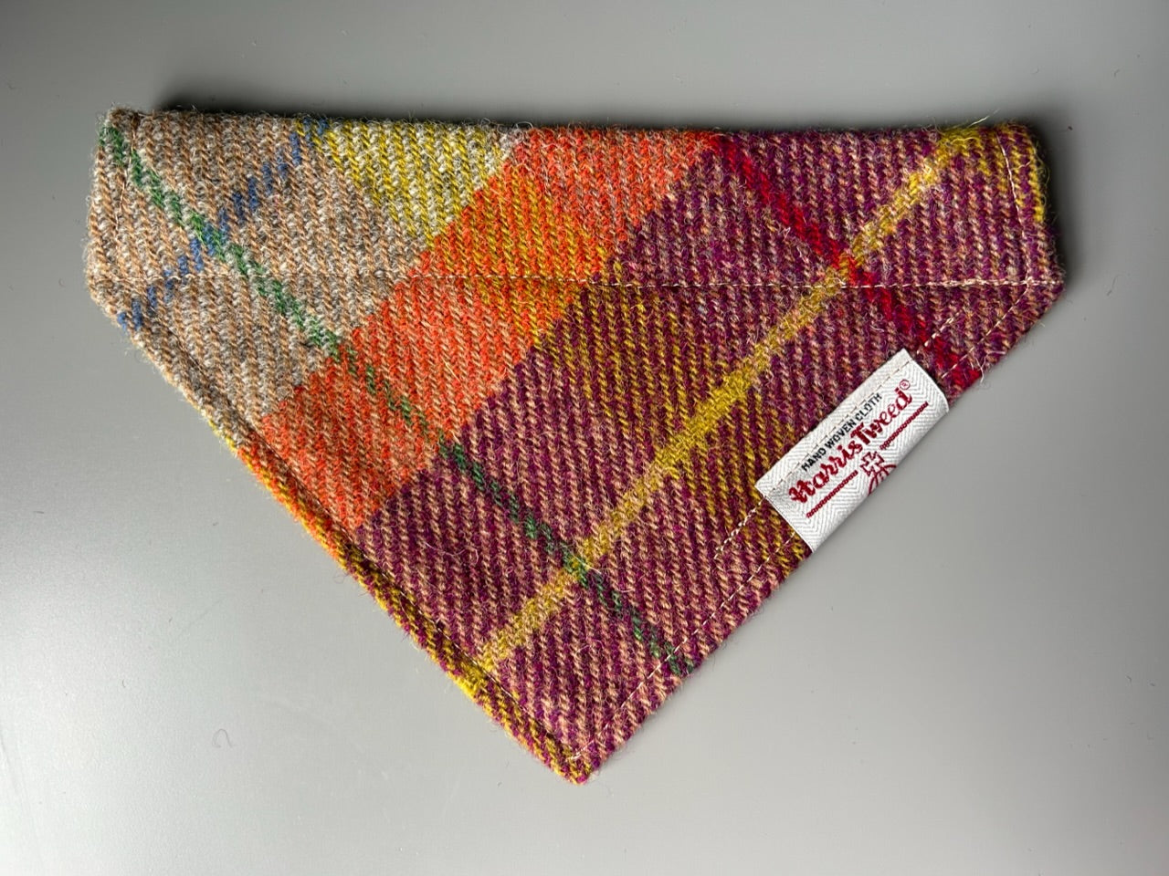 Harris Tweed dog bandana neckerchief in orange beige and purple in a check, tartan pattern. Sizes S M L XL pet scarf