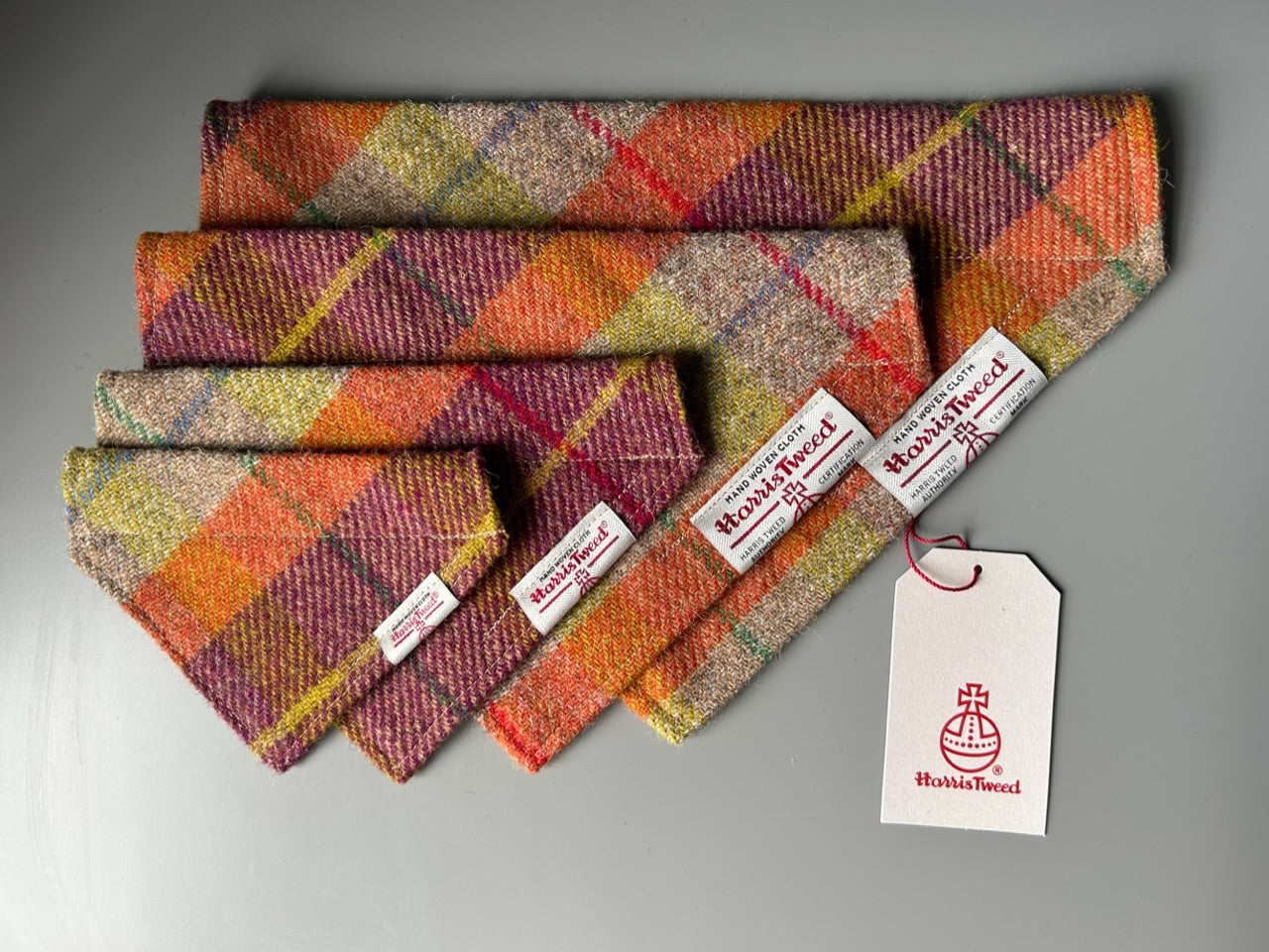 Harris Tweed dog bandana neckerchief in orange beige and purple in a check, tartan pattern. Sizes S M L XL pet scarf