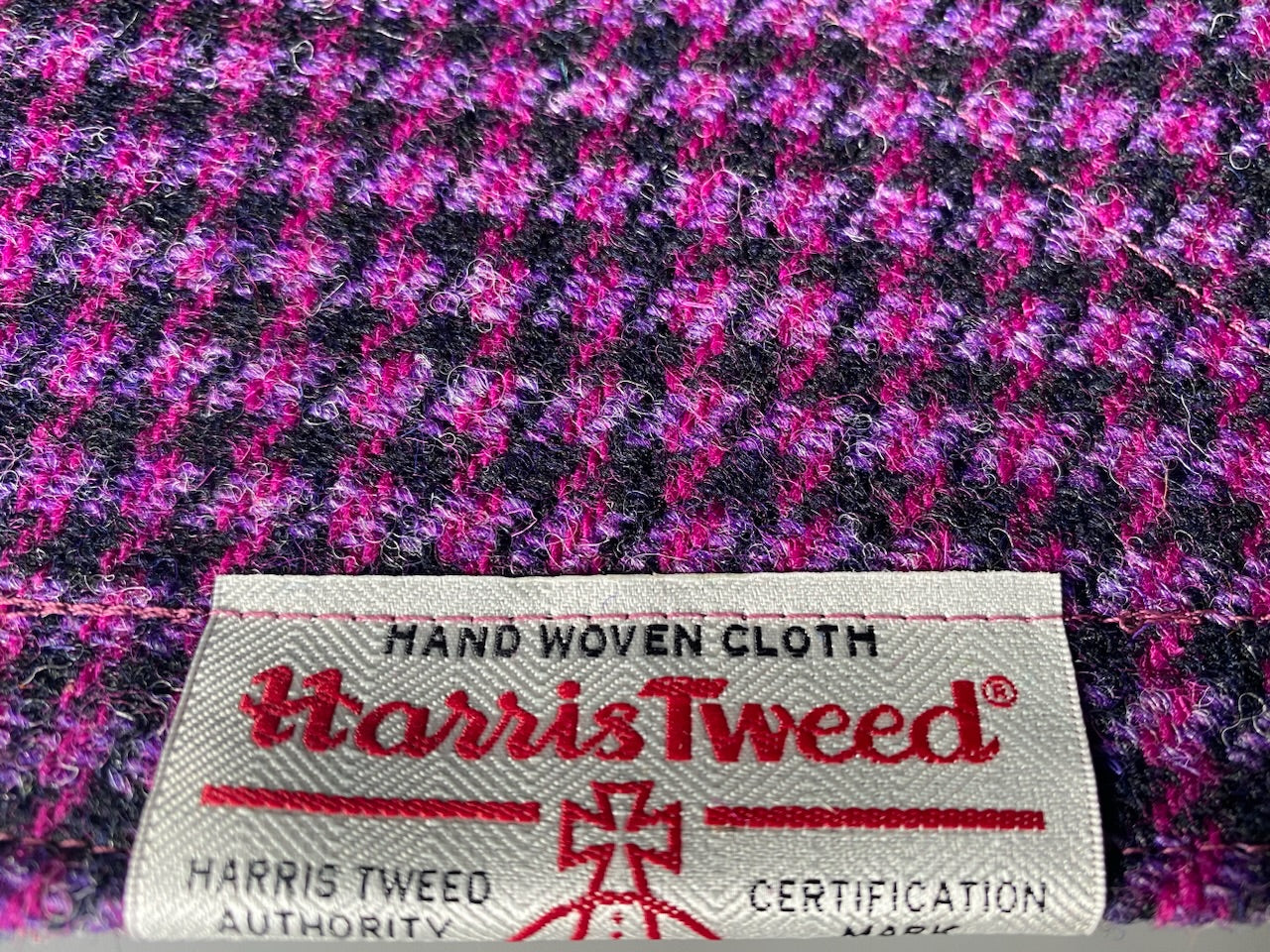 Harris Tweed dog bandana neckerchief in bright pink / purple and black in houndstooth dogtooth check pattern. Sizes S M L XL  pet scarf