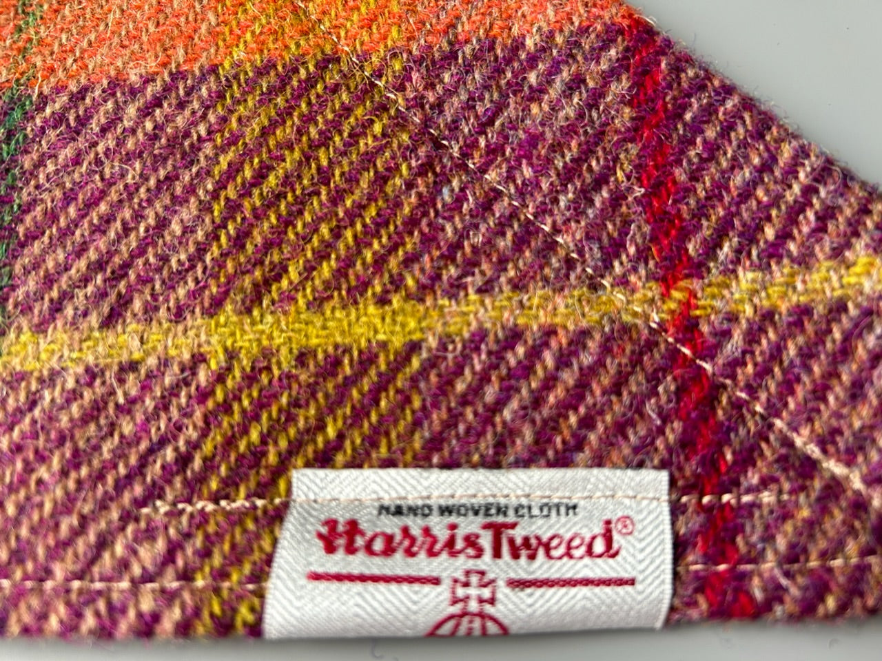 Harris Tweed dog bandana neckerchief in orange beige and purple in a check, tartan pattern. Sizes S M L XL pet scarf