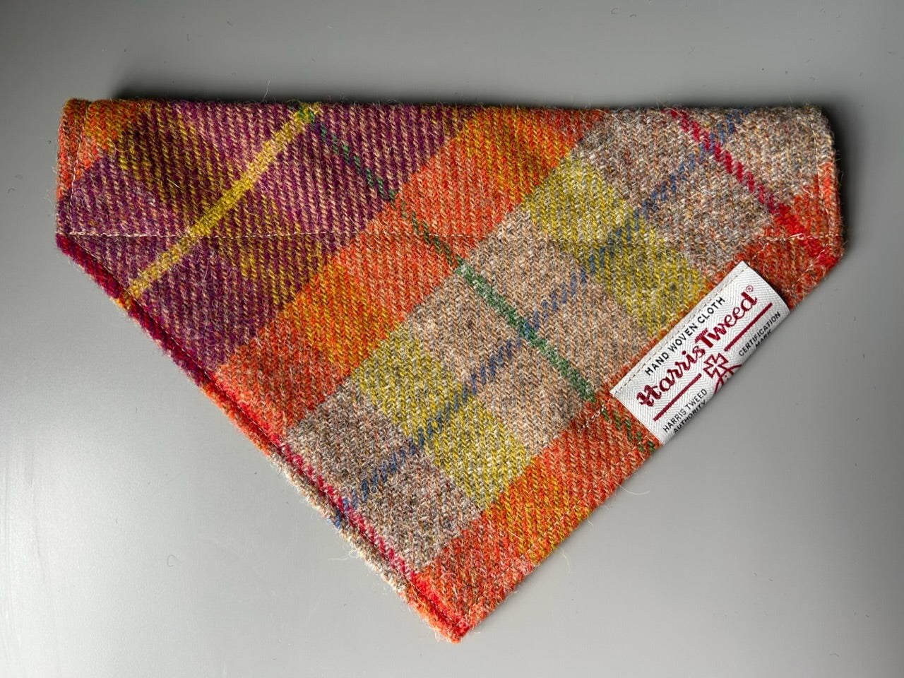 Harris Tweed dog bandana neckerchief in orange beige and purple in a check, tartan pattern. Sizes S M L XL pet scarf