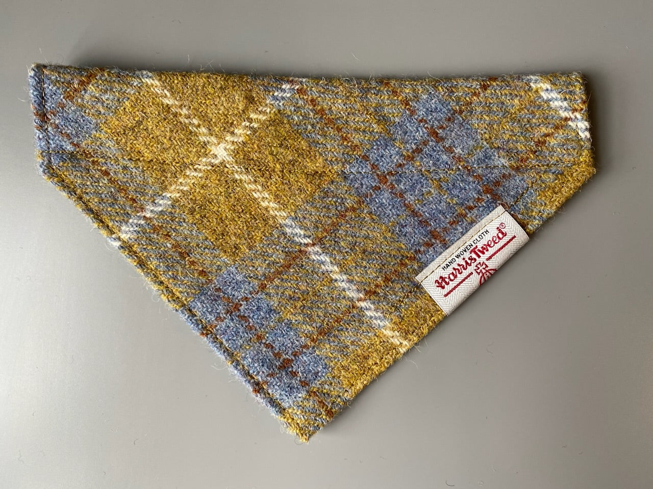 Harris Tweed dog bandana neckerchief in Mustard yellow / gold & blue check tartan or plaid pattern. Sizes S, M, L + XL pet scarf